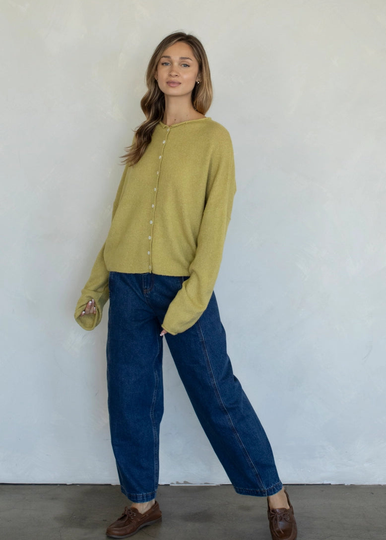 Full-body view of the Hailey Button Down Cardigan (Piper Cardigan) in moss styled with jeans