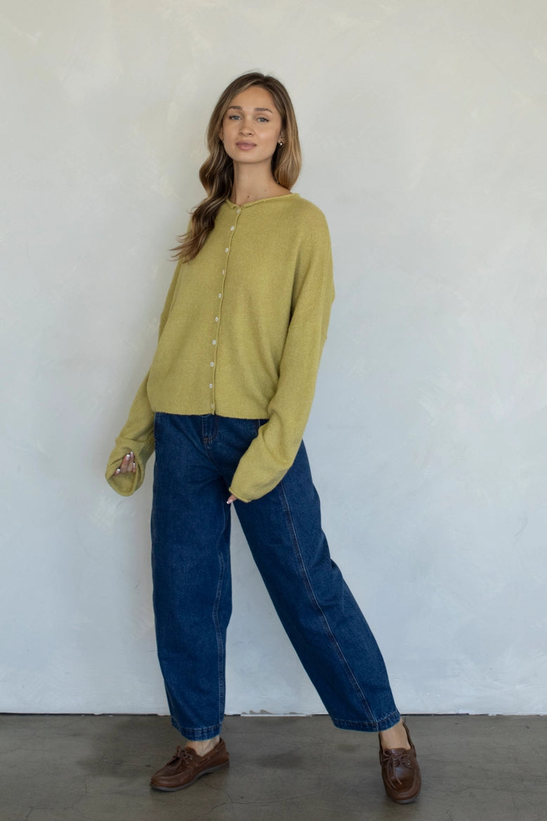 Full-body view of the Hailey Button Down Cardigan (Piper Cardigan) in moss styled with jeans