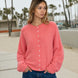 Model wearing the Hailey Button Down Cardigan in Peach for an easy everyday outfit