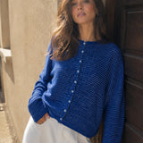 Model wearing Hailey pin-striped royal cardigan with denim pants