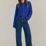 Royal blue pin-striped cardigan styled with casual denim outfit