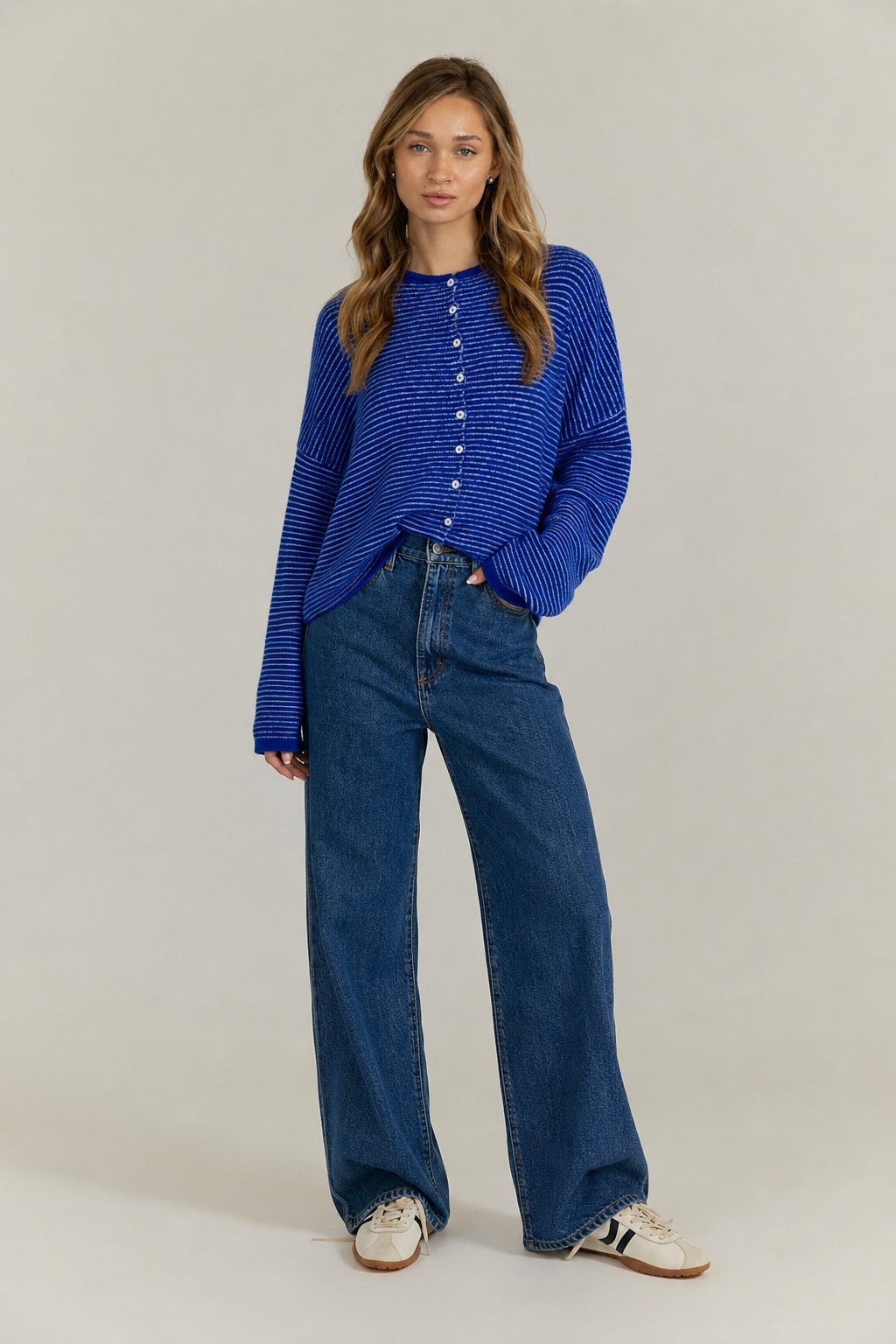 Royal blue pin-striped cardigan styled with casual denim outfit