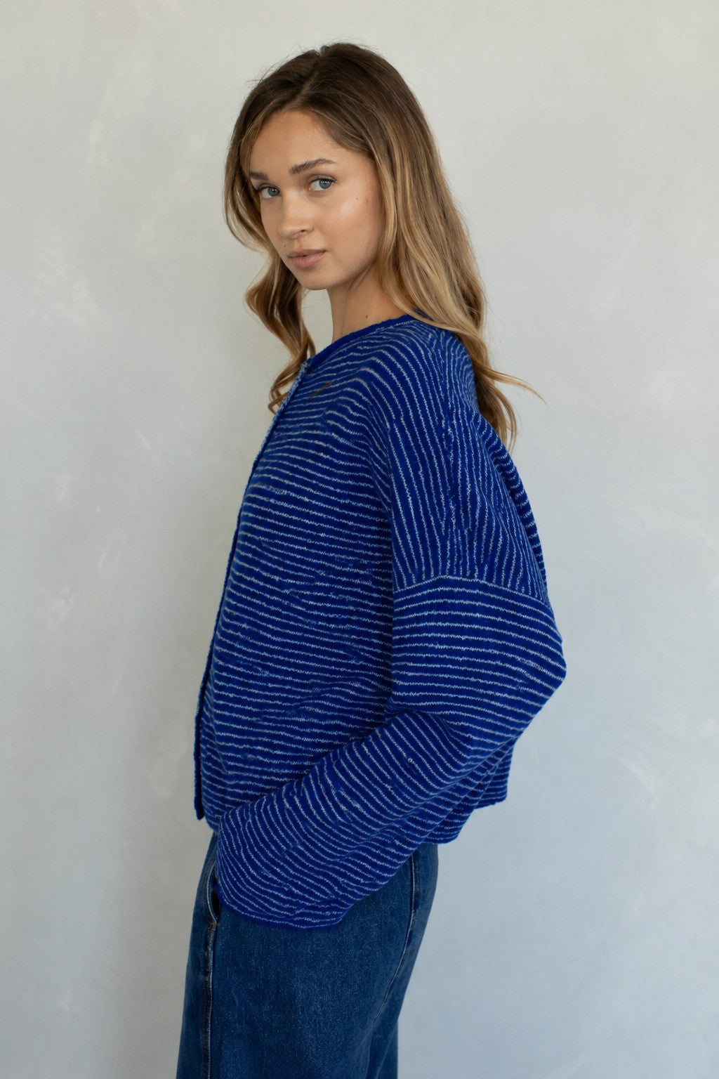 Side view of Hailey royal blue striped cardigan