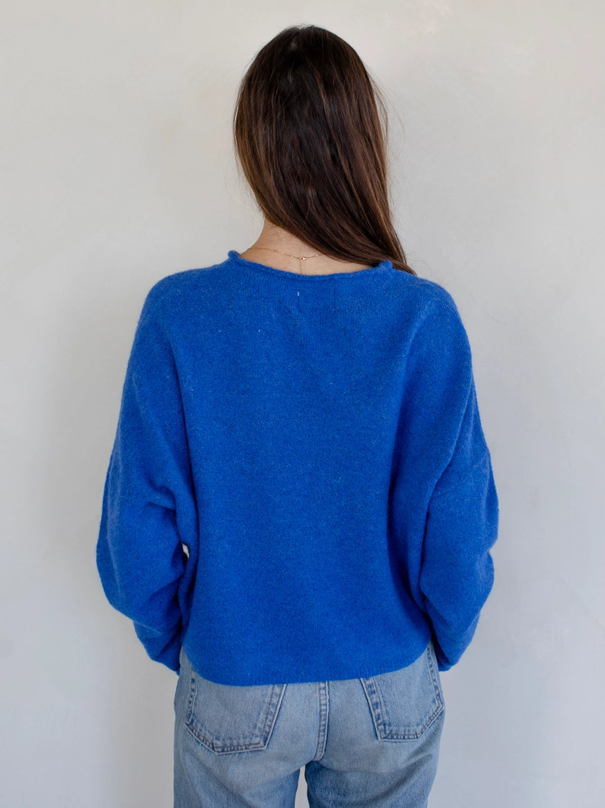 Back of the Hailey Button Down Cardigan (Piper Cardigan) in blue — classic lightweight knit design with simple drape.