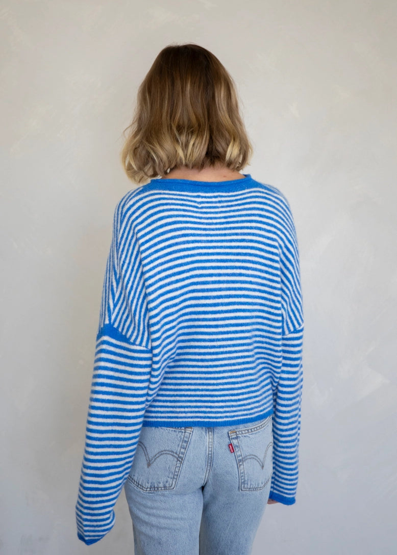 Back of the Hailey Button Down Cardigan, also called the Piper Cardigan, in mini striped blue — casual soft knit design.