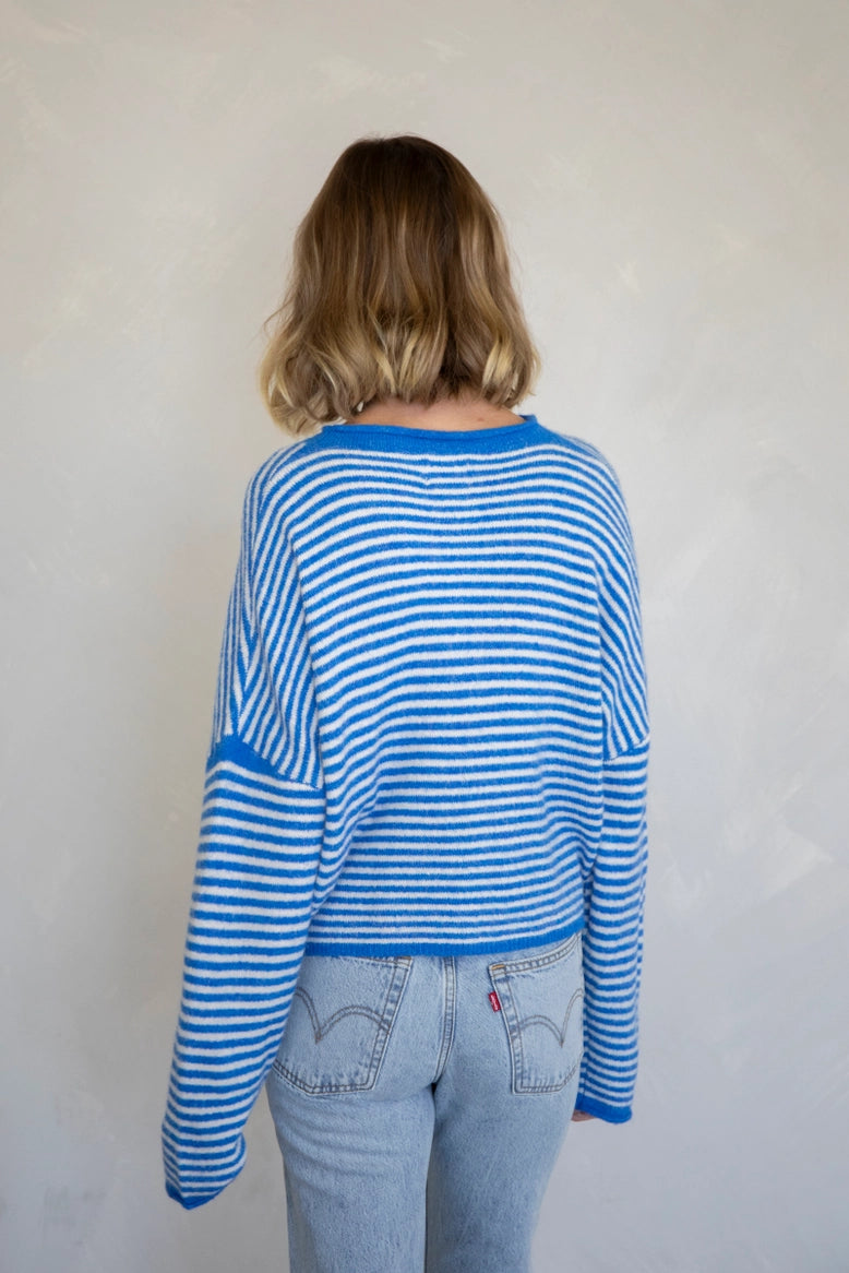 Back of the Hailey Button Down Cardigan, also called the Piper Cardigan, in mini striped blue — casual soft knit design.
