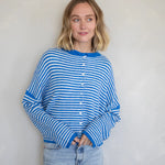 Woman wearing the Hailey Button Down Cardigan, also known as the Piper Cardigan, in mini striped blue — soft knit with button front.