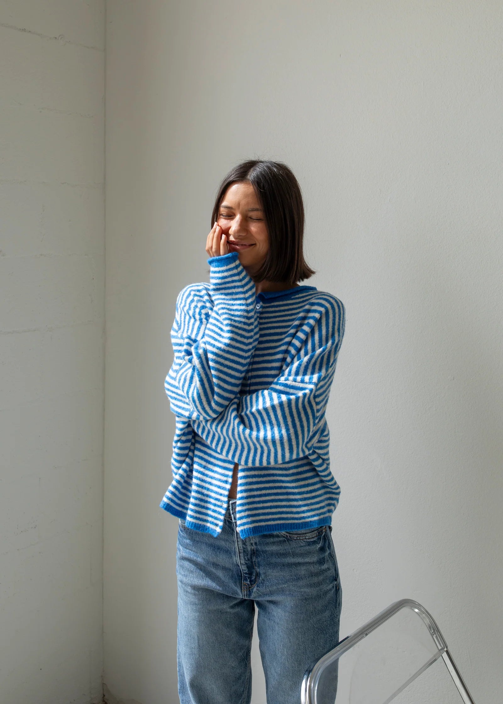Woman wearing the mini striped blue Piper Cardigan (Hailey Button Down Cardigan) — soft, casual women’s knit sweater.