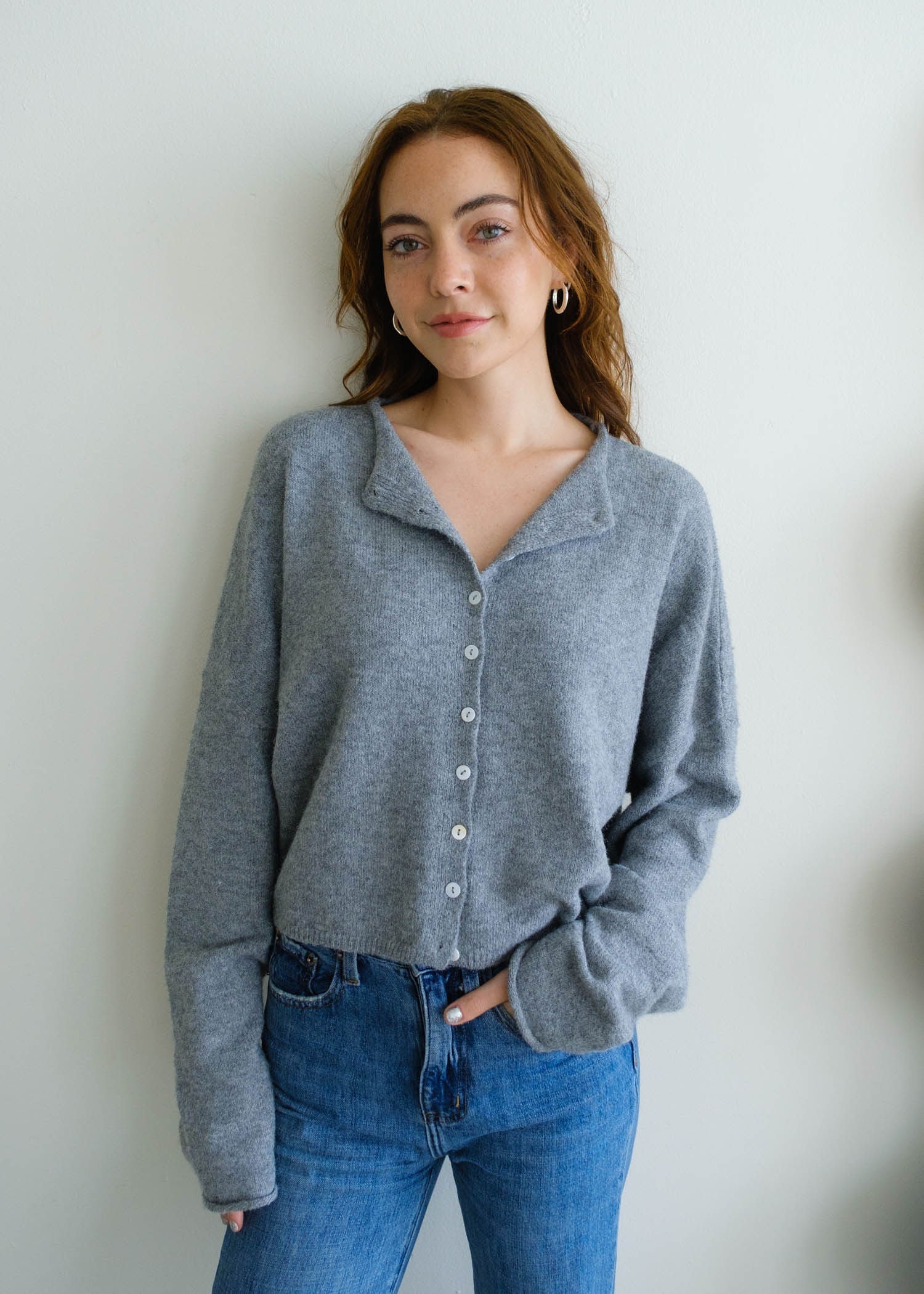 Front portrait of model wearing the Hailey Button Down Cardigan (Piper Cardigan) in heather grey