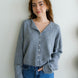 Front portrait of model wearing the Hailey Button Down Cardigan (Piper Cardigan) in heather grey