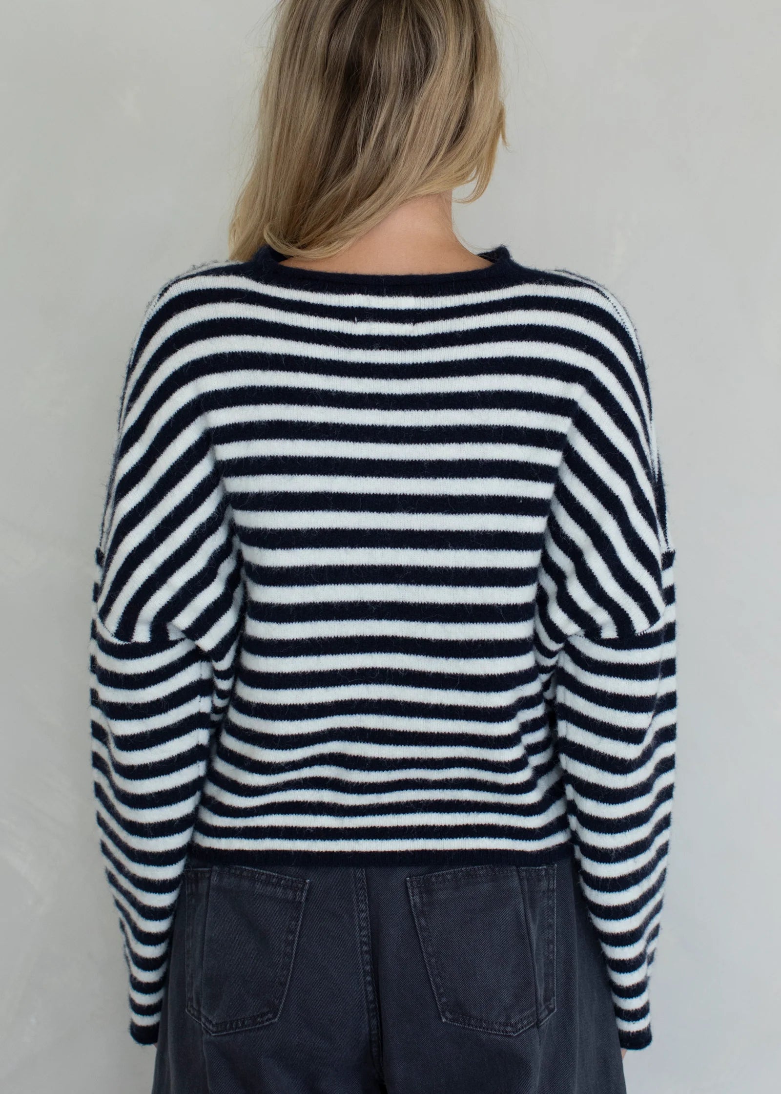 Back view of the Piper Cardigan in navy striped showing classic silhouette
