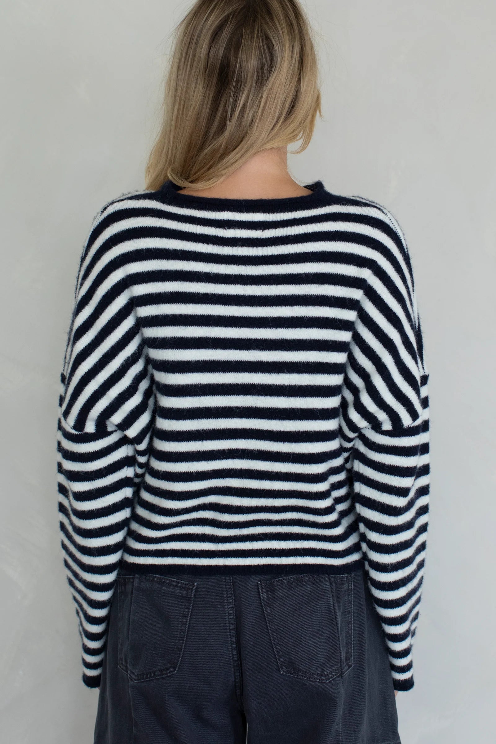 Back view of the Piper Cardigan in navy striped showing classic silhouette