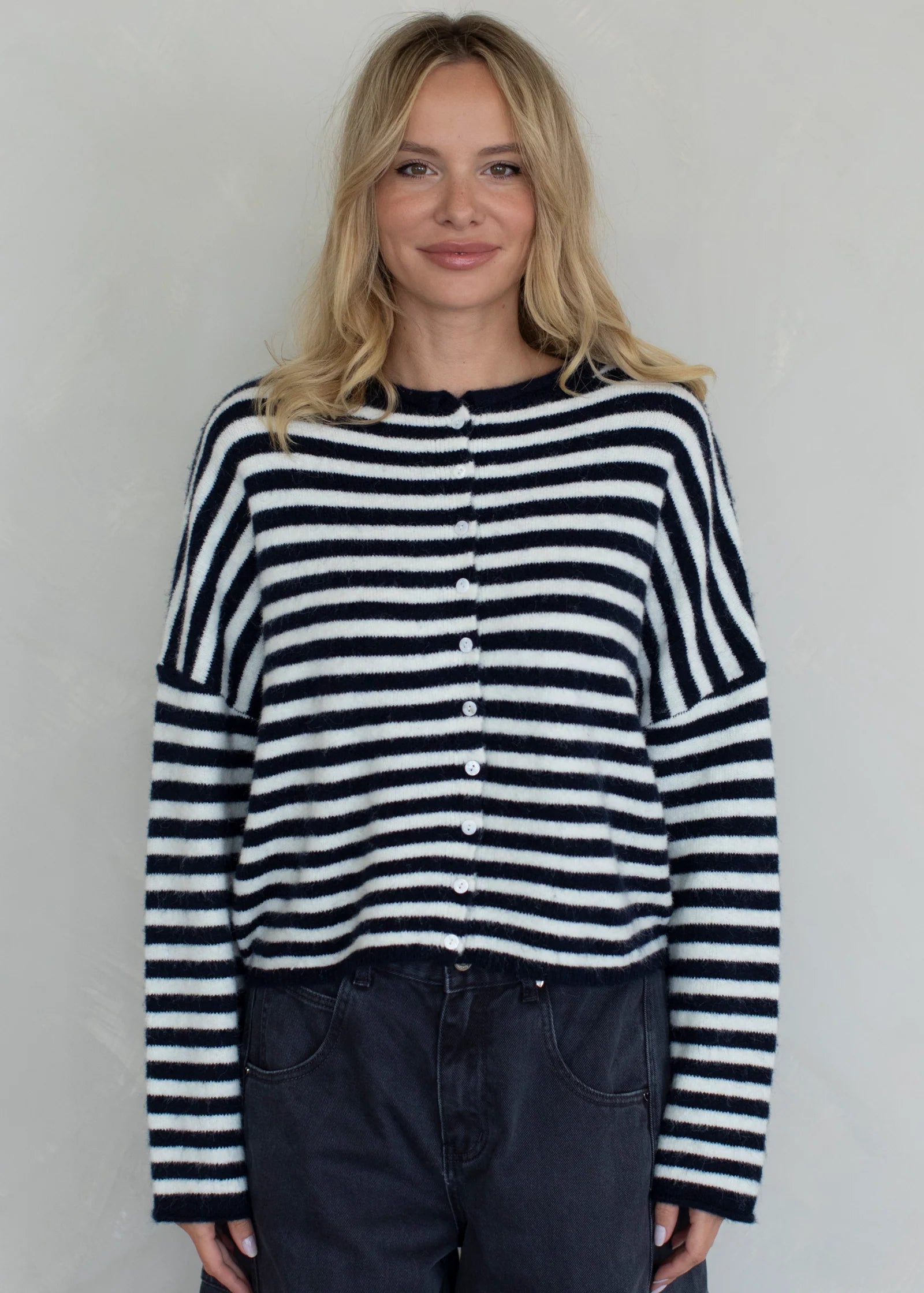 Front view of the navy striped Piper Cardigan showing button-down design