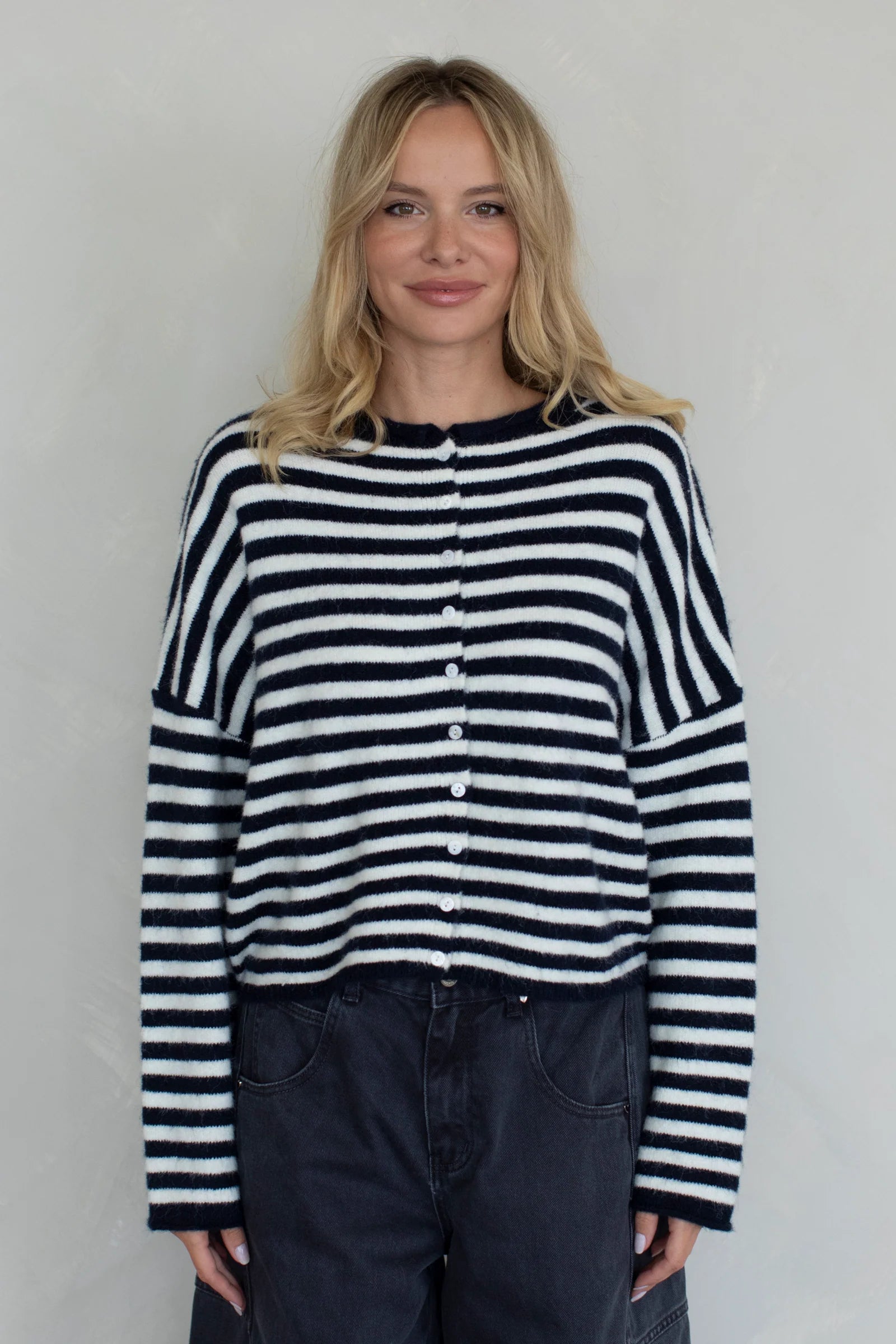 Front view of the navy striped Piper Cardigan showing button-down design