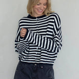 Front portrait of model wearing the Hailey Button Down Cardigan (Piper Cardigan) in navy striped