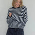 Front portrait of model wearing the Hailey Button Down Cardigan (Piper Cardigan) in navy striped