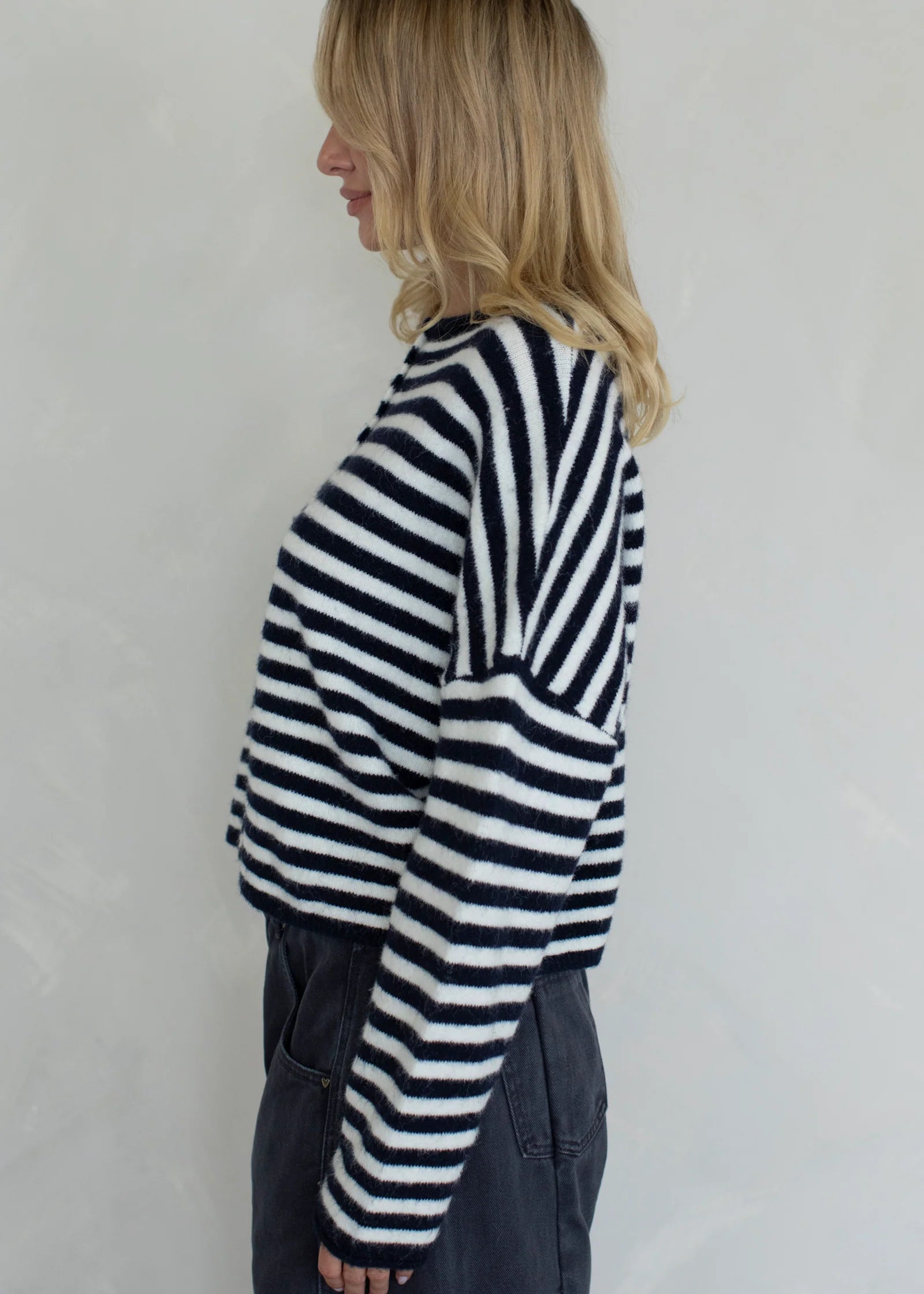 Side view of the Hailey Button Down Cardigan in navy striped highlighting relaxed fit