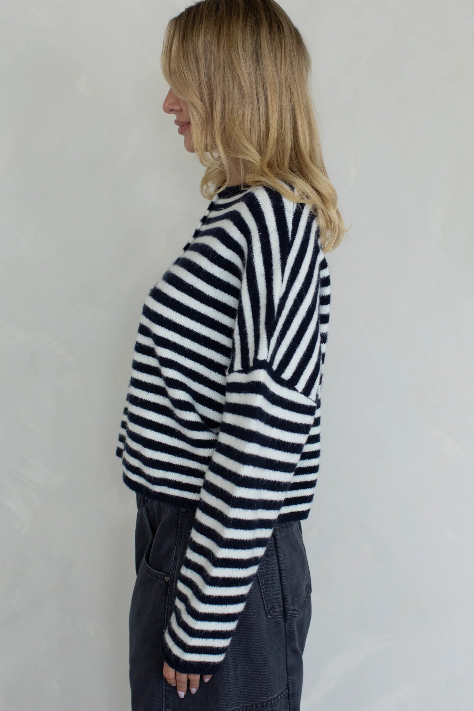 Side view of the Hailey Button Down Cardigan in navy striped highlighting relaxed fit