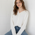 Front portrait of model wearing the Hailey Button Down Cardigan (Piper Cardigan) in white / off-white