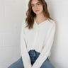 Front portrait of model wearing the Hailey Button Down Cardigan (Piper Cardigan) in white / off-white