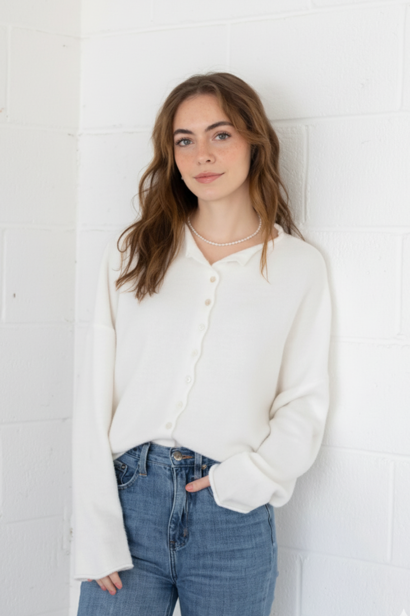 Styled front view of the Hailey Button Down Cardigan (Piper Cardigan) in off-white paired with jeans