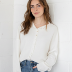 Styled front view of the Hailey Button Down Cardigan (Piper Cardigan) in off-white paired with jeans