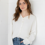Styled front view of the Hailey Button Down Cardigan (Piper Cardigan) in off-white paired with jeans