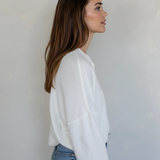 Side view of the Hailey Button Down Cardigan (Piper Cardigan) in off-white highlighting silhouette