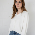 Relaxed front view of the Hailey Button Down Cardigan (Piper Cardigan) in soft white showing drape