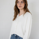 Relaxed front view of the Hailey Button Down Cardigan (Piper Cardigan) in soft white showing drape