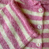 Close-up of the Hailey Button Down Cardigan in Striped Bubblegum showing the soft knit texture, buttons, and pink stripe detail