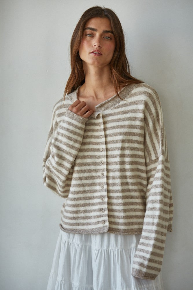 Woman wearing a striped Hailey Button Down cardigan against a plain background