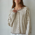Woman wearing a striped Hailey Button Down cardigan against a plain background