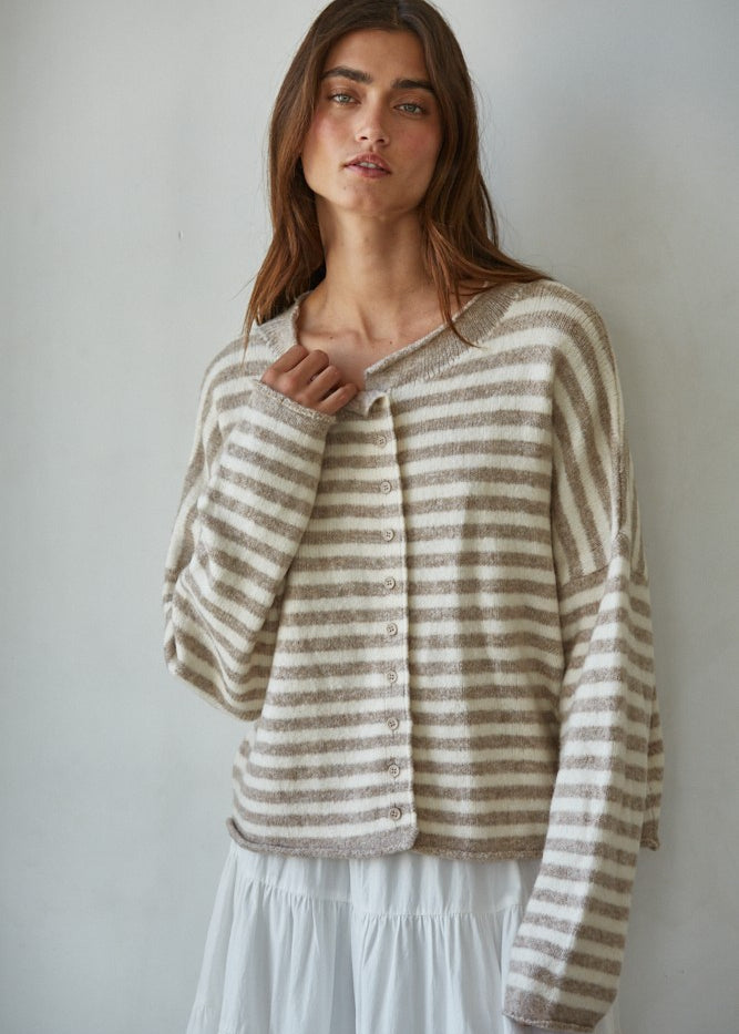 Woman wearing a striped Hailey Button Down cardigan against a plain background