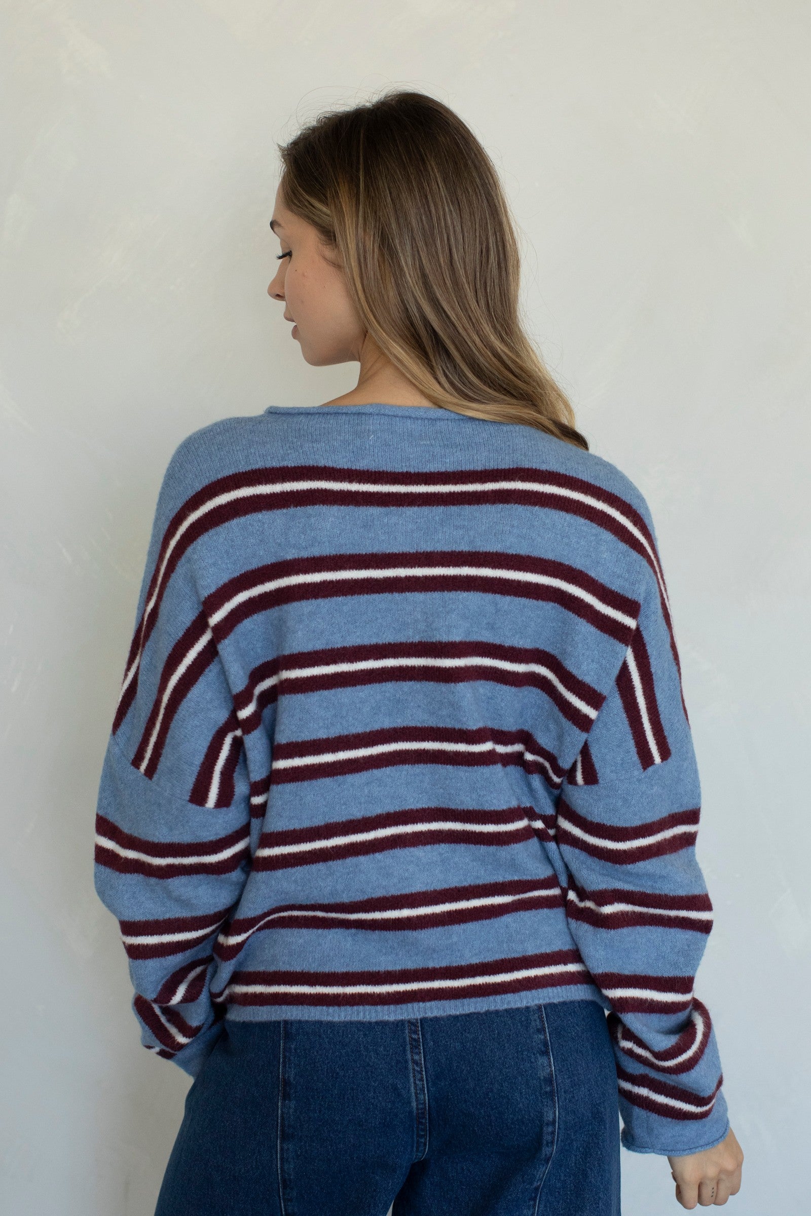 Back view of the Hailey Button Down Cardigan in Varsity Striped Dusty Blue