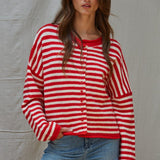 Front portrait of model wearing the Hailey Button Down Cardigan Warmth Edition (Kelsey Cardigan) in red and ivory stripes