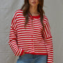 Front portrait of model wearing the Hailey Button Down Cardigan Warmth Edition (Kelsey Cardigan) in red and ivory stripes