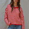 Front portrait of model wearing the Hailey Button Down Cardigan Warmth Edition (Kelsey Cardigan) in red and ivory stripes