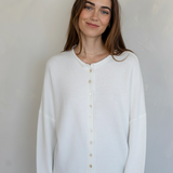 Front view of model wearing the Hailey Button Down Cardigan (Piper Cardigan) in white / off-white
