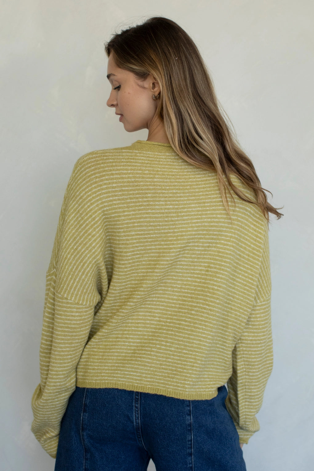 Back view of honey pin striped Hailey cardigan with soft lightweight knit