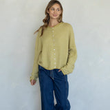 Woman wearing honey pin striped Hailey cardigan styled with casual outfit and relaxed fit