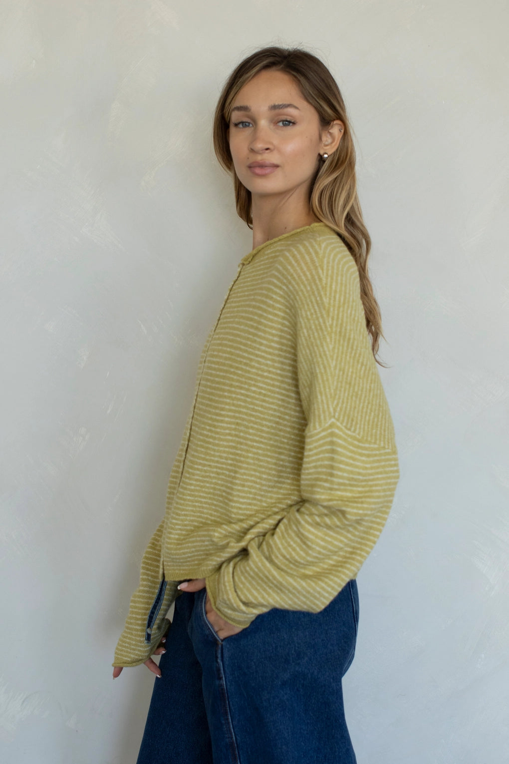 Side view of Hailey cardigan in honey pin stripe lightweight knit relaxed fit