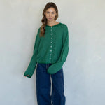 Woman wearing kelly green pin striped Hailey cardigan styled with casual outfit and relaxed fit