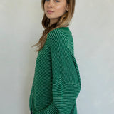 Side view of Hailey cardigan in kelly green pin stripe lightweight knit relaxed fit