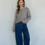 Woman wearing natural pin striped Hailey cardigan styled with casual outfit and relaxed fit