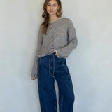 Woman wearing natural pin striped Hailey cardigan styled with casual outfit and relaxed fit