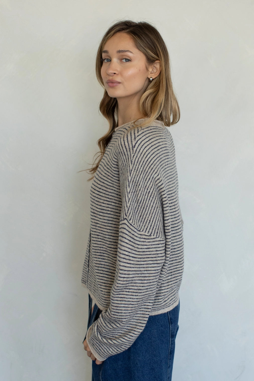 Side view of Hailey cardigan in natural pin stripe lightweight knit relaxed fit