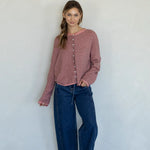 Woman wearing rose pin striped Hailey cardigan styled with casual outfit and relaxed fit