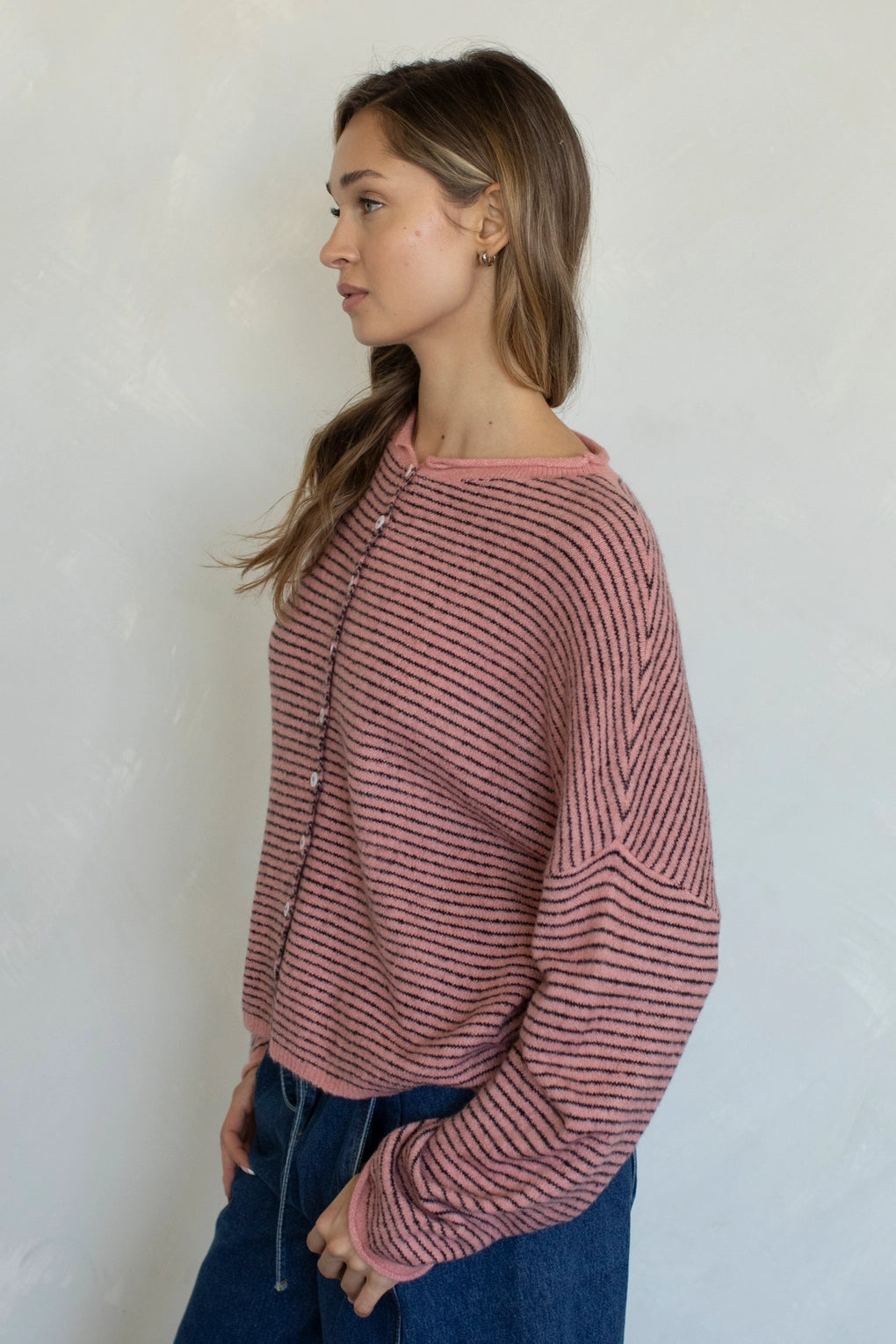 Side view of Hailey cardigan in rose pin stripe lightweight knit relaxed fit