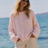 Close-up front view of the Hailey Mini Striped Pink Button Down Cardigan styled on model